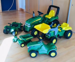 a collection of john deere farm vehicles