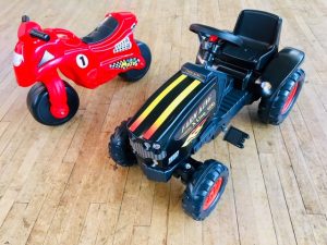 red motorbike and black farm king tractor ride on toys