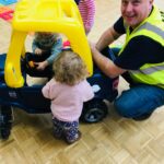 Children playing at a Ride on Time party